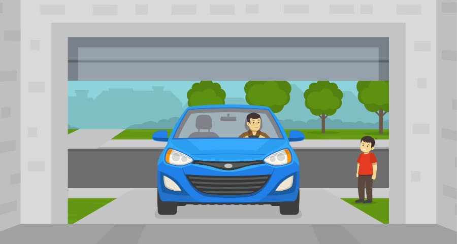Image of a resident driving into his garage with a child waiting nearby.